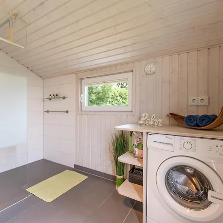 4 Personen Luxusferienhaus Mit Sauna, Kaminofen, Klimaanlage, Kanu Und Seeblick In Otterndorf